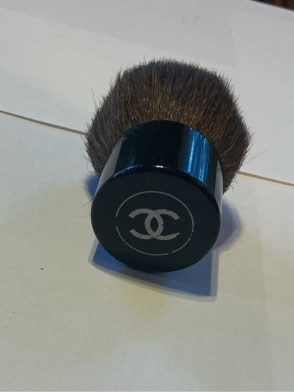 Chanel Kabuki Brush, 2” high by 1.5” wide
